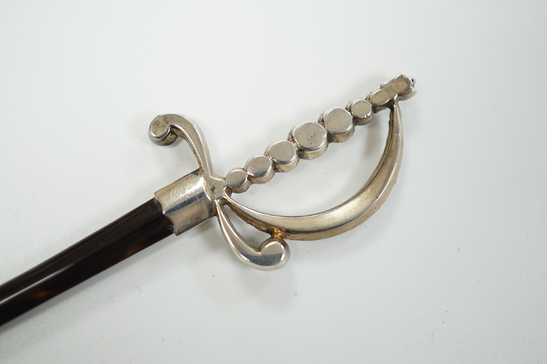 An early 20th century white metal and paste mounted tortoiseshell model of a court sword, 17.7cm, in fitted case.